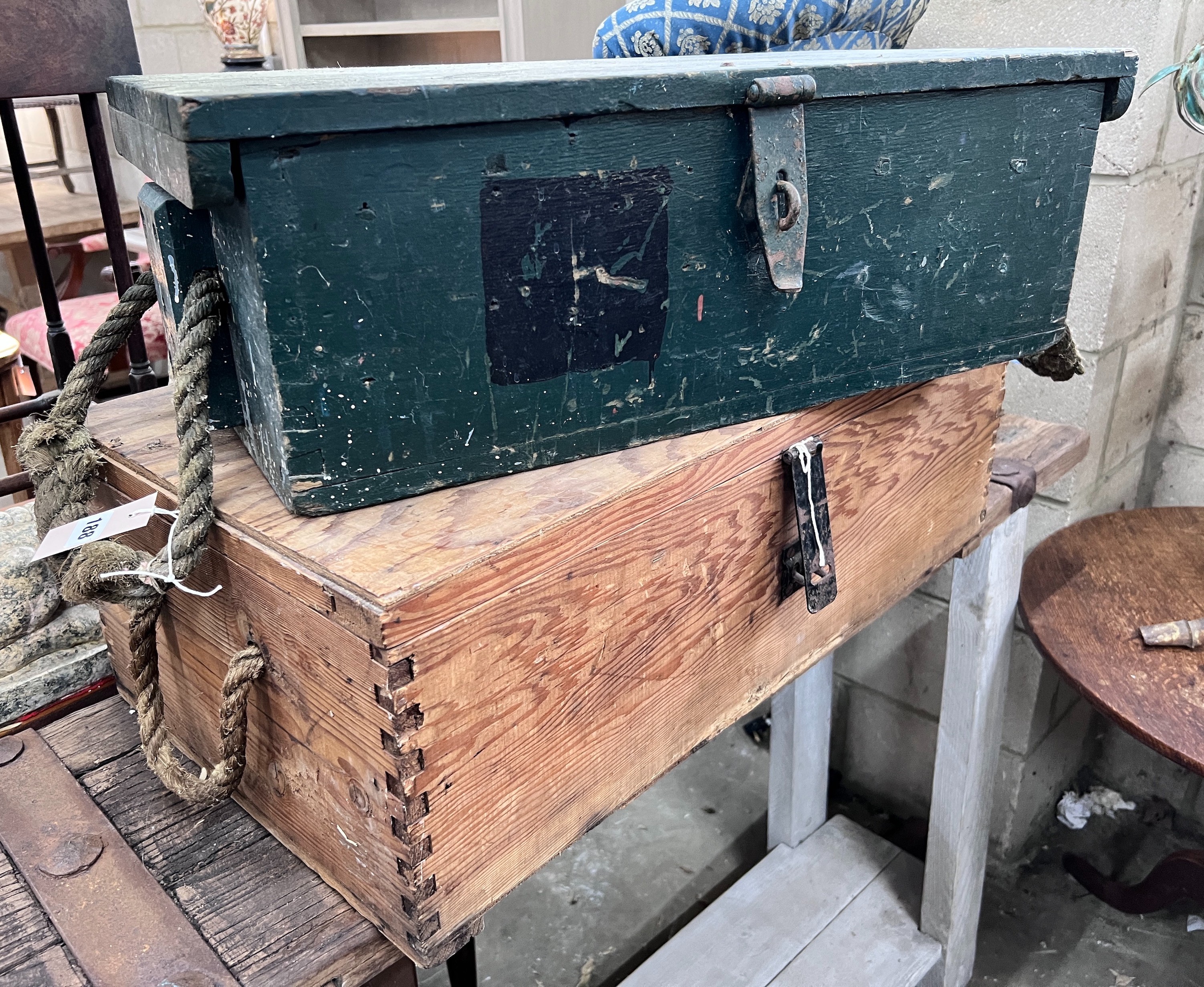 A green painted wooden trunk, probably military issue, width 66cm, and a plywood and pine trunk, width 71cm *Please note the sale commences at 9am.